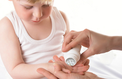 Child receiving pills