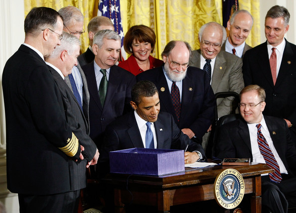 Obama signs the National Defense Appropriations Act